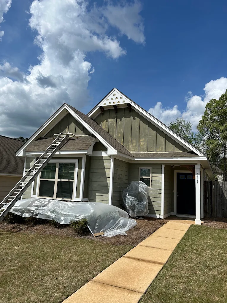 House exterior masked and prepped for painting