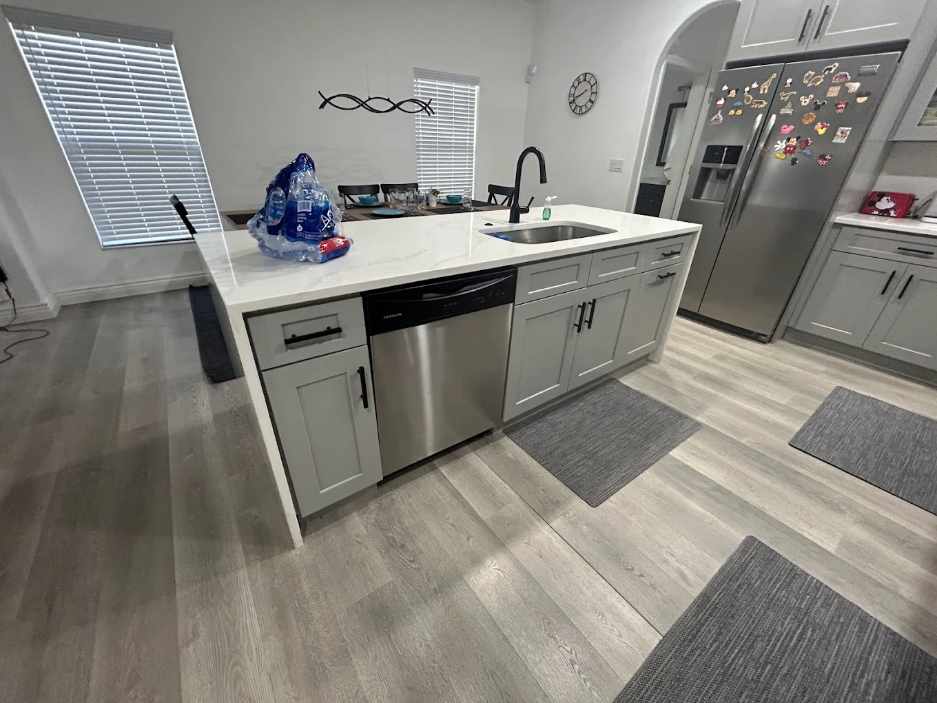 Kitchen remodel with new island, sink and stainless appliances