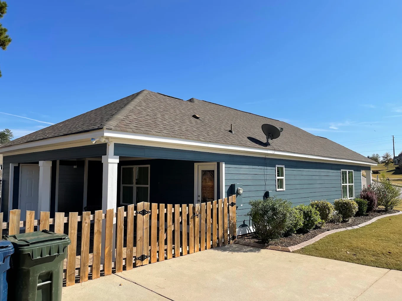 New wooden picket fence and gate installation